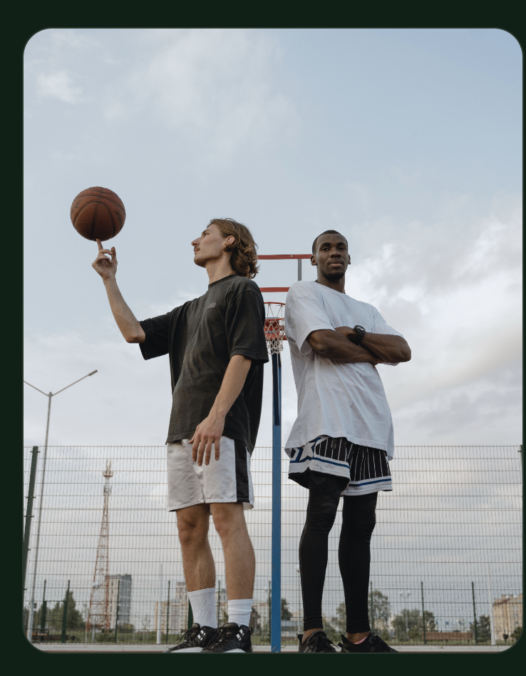Two mates on an outdoor basketball court